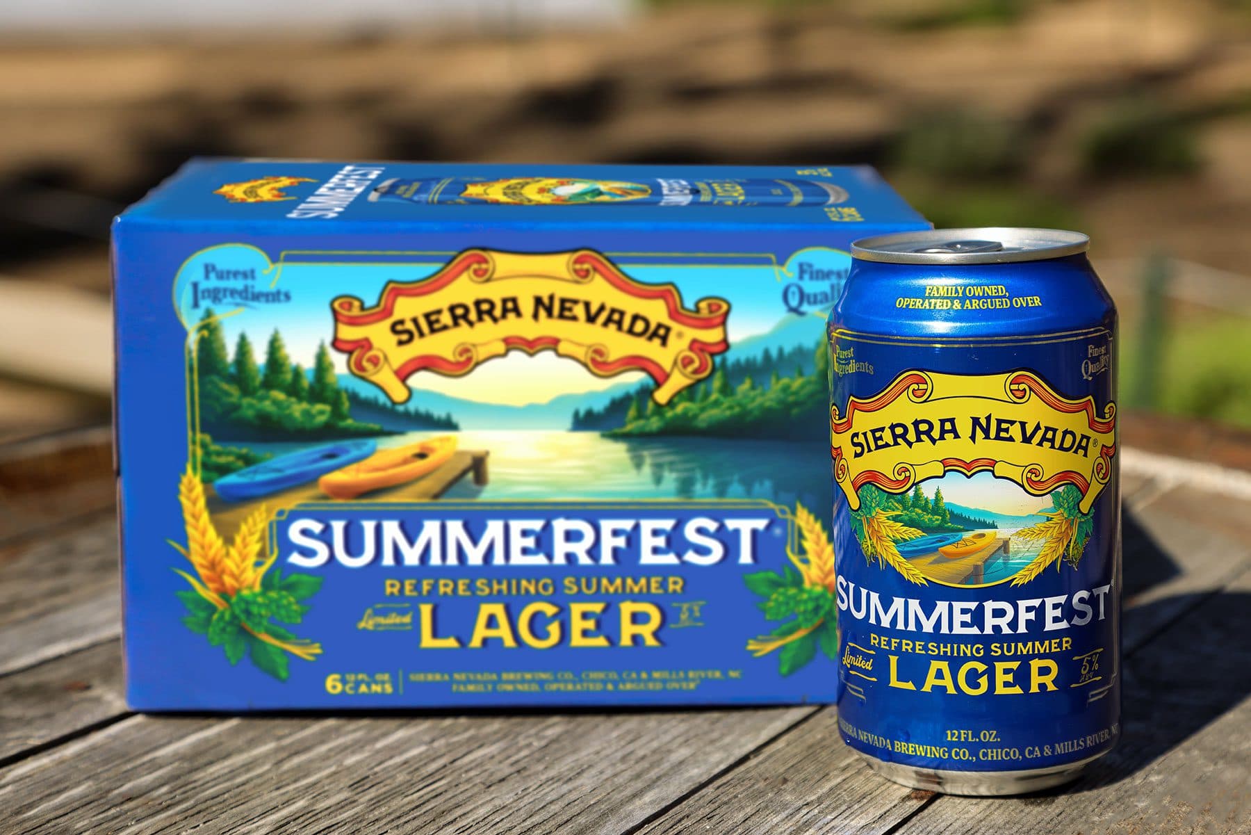 A six-pack and can of Sierra Nevada Summerfest on a wooden table outdoors